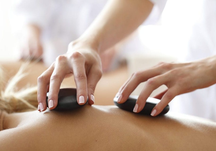 Close-up of young woman having reflexology