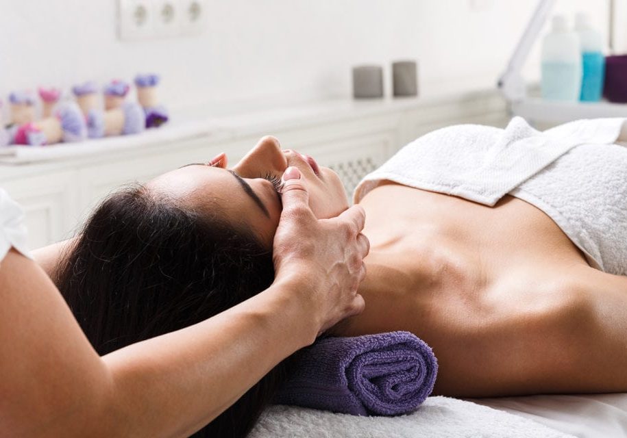 Close-up of young woman having reflexology