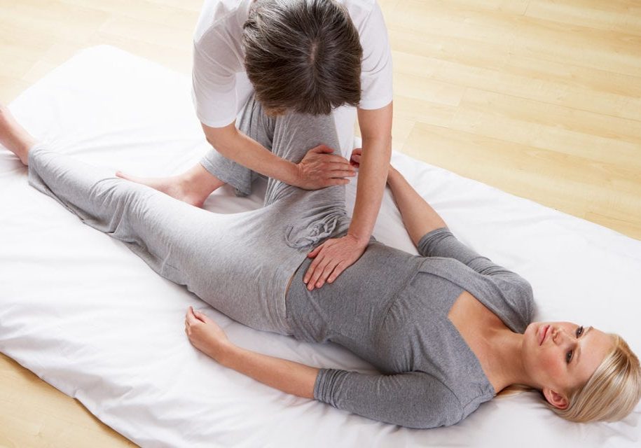 Close-up of young woman having reflexology